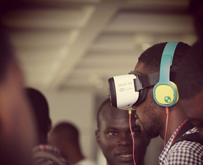 Founder of Nubian VR Kabiru instructing a user through the Nubian VR modules 