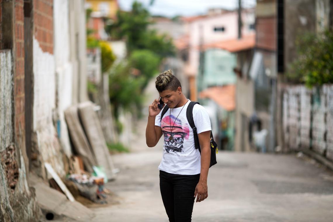 Rondiney Diniz, 20, speaks on his mobile phone on a street in the city of Fortaleza, capital of the state of Ceará, in Northeastern Brazil. 