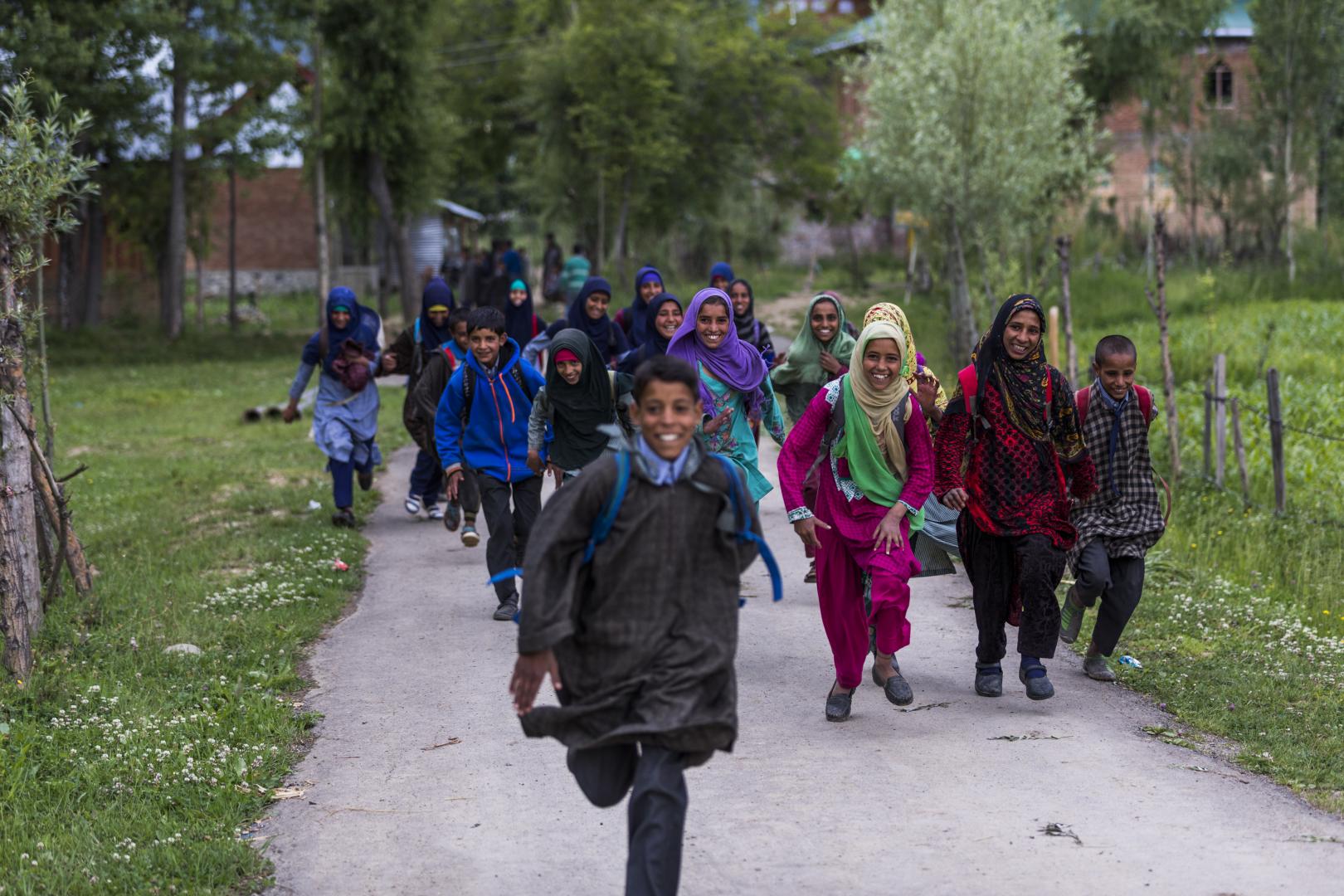 Children react as they leave for their homes after they attend classes at the Special Learning Centre (SLC) in Ringzabal in Budgam, Jammu & Kashmir.