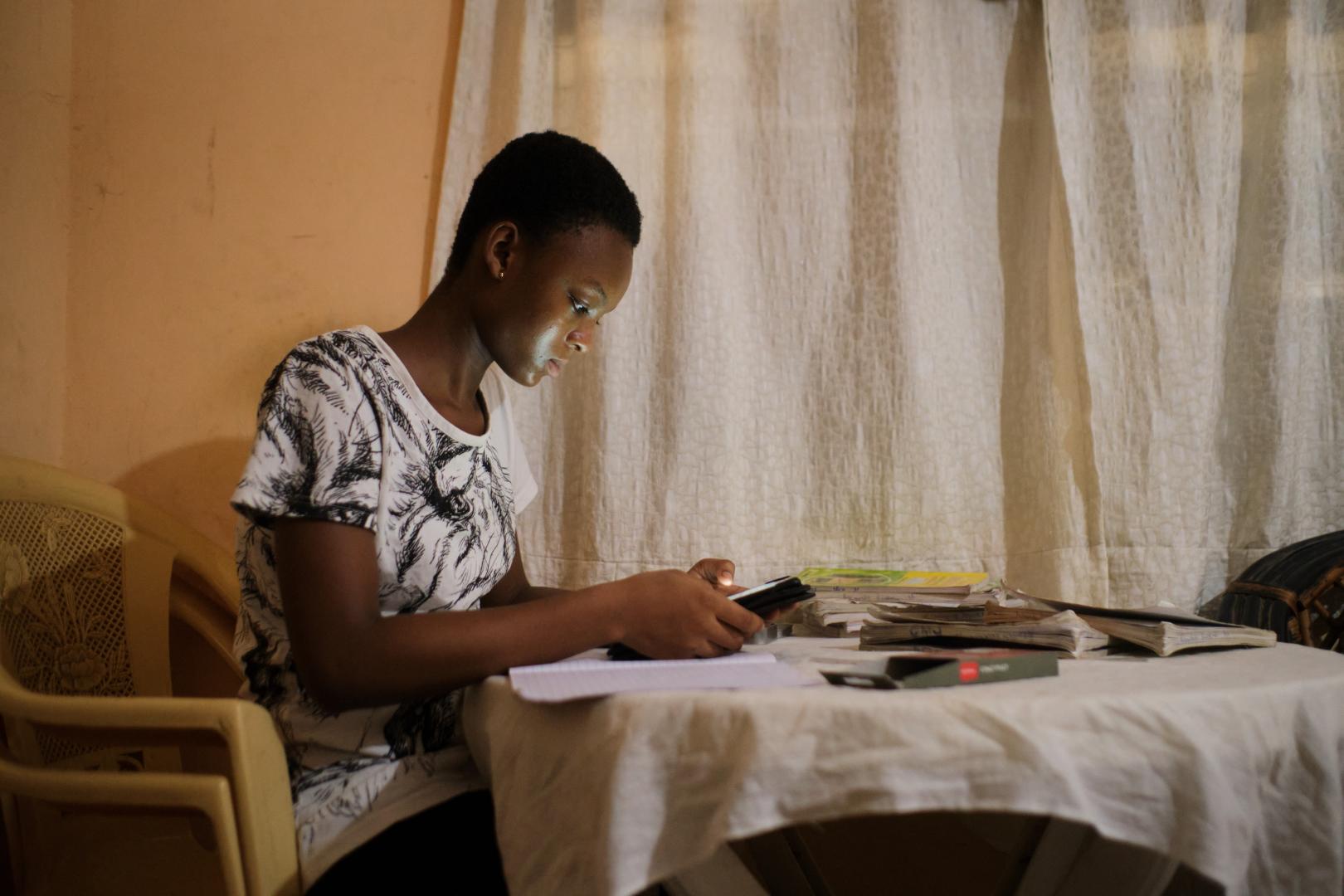 Wendy, 14, studies from home. She receives her lessons through the internet
